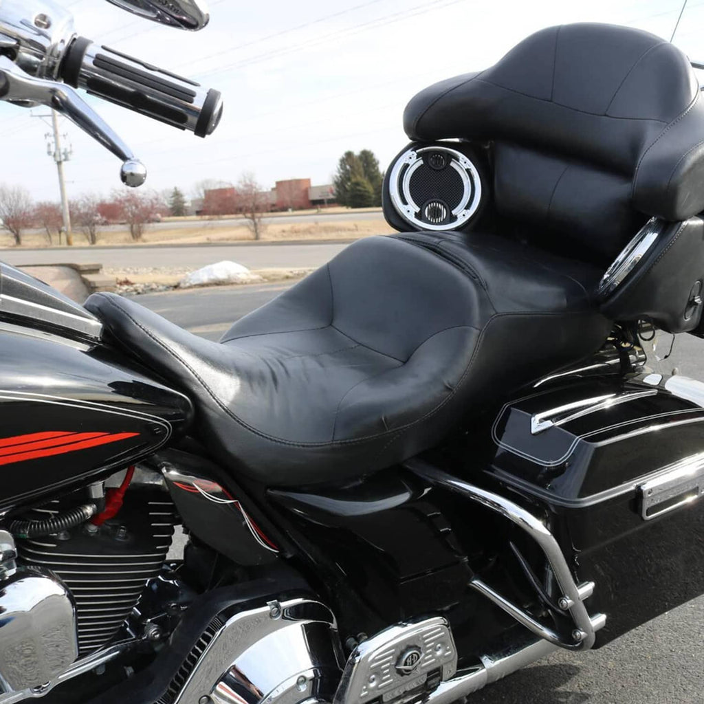 Black motorcycle seat with curved contours and stitched seams in a rider-backrest profile