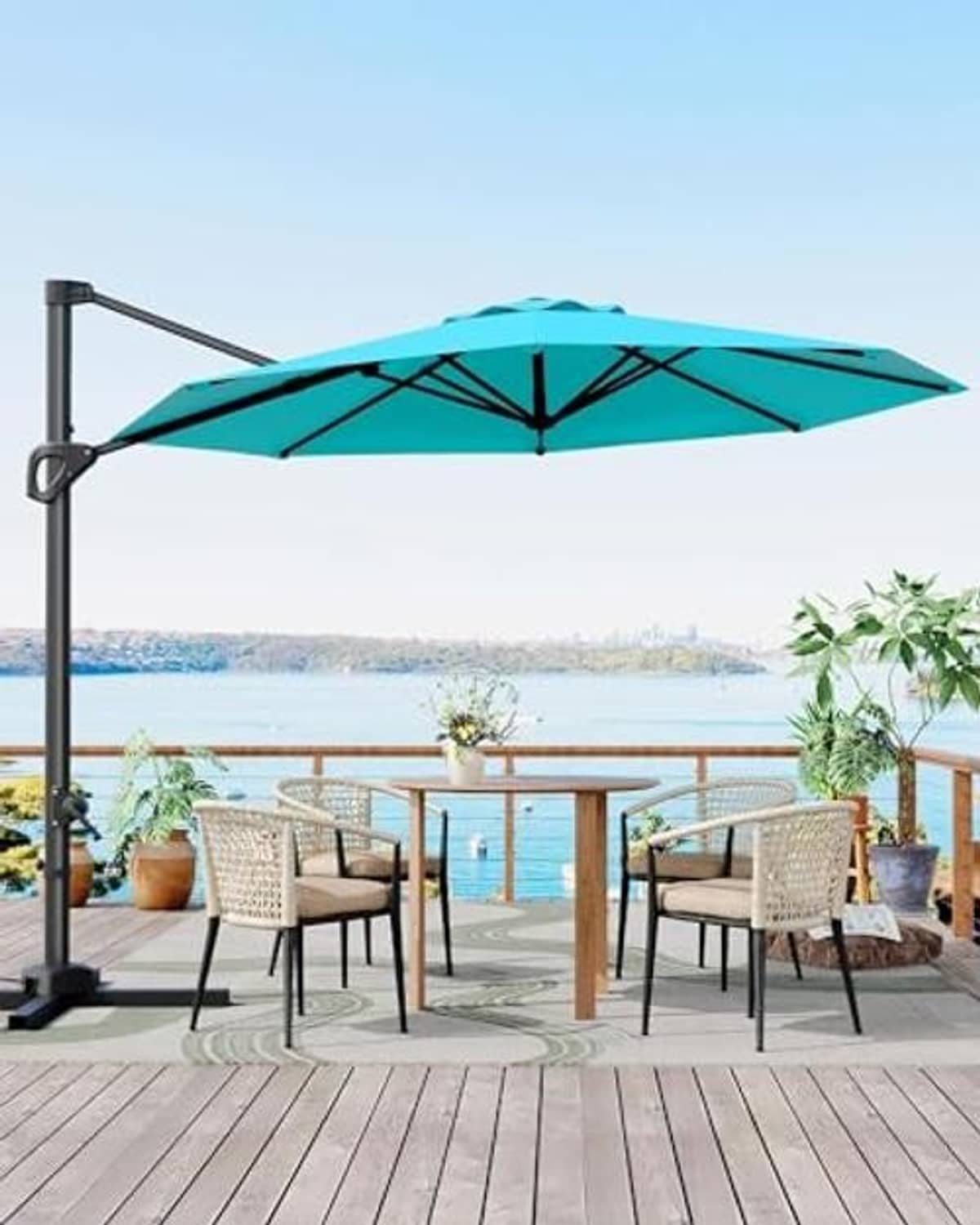 Turquoise cantilever patio umbrella with open canopy and angled support pole.