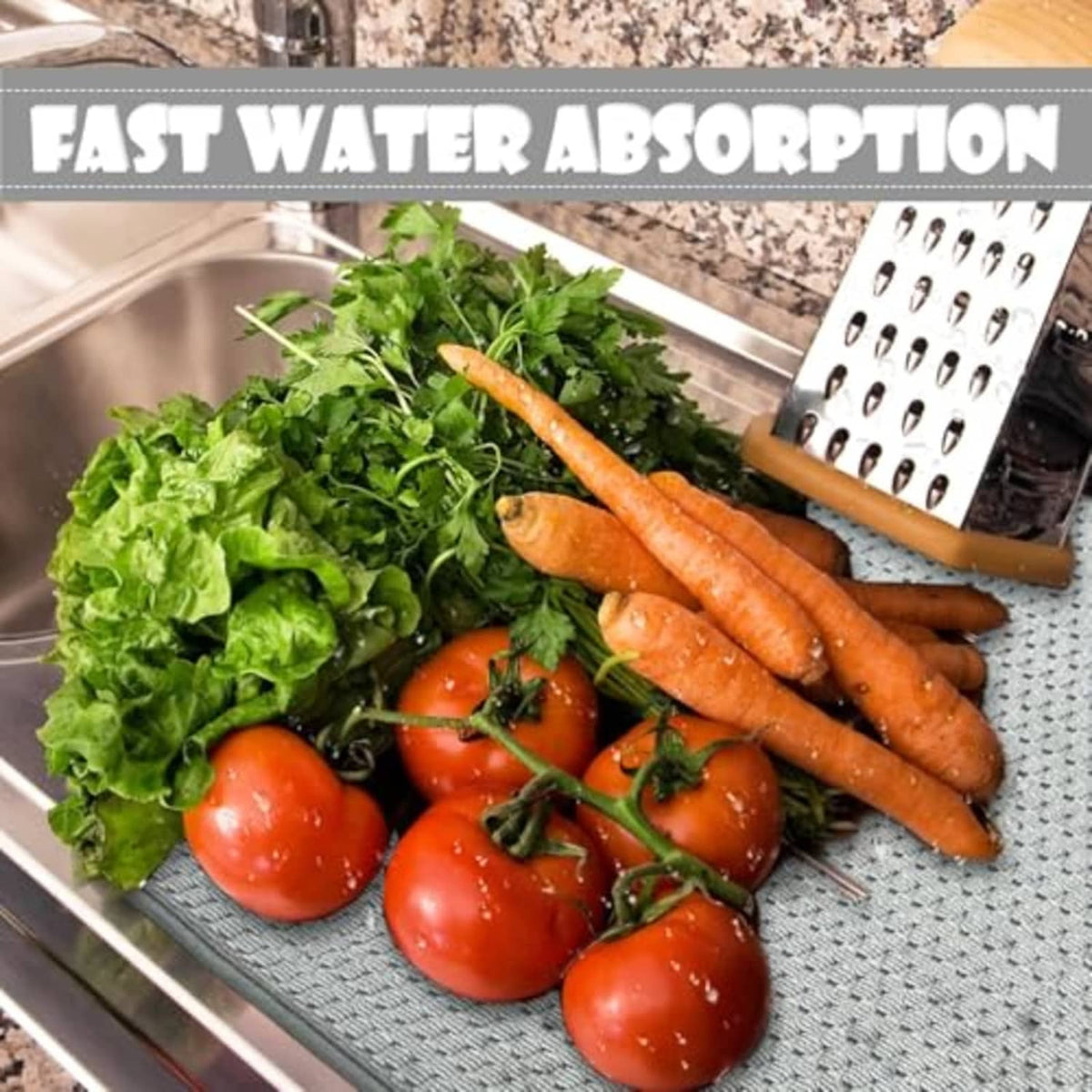 Gray microfiber dish-drying mat on countertop; absorbent pad under rinsed vegetables and bowls.