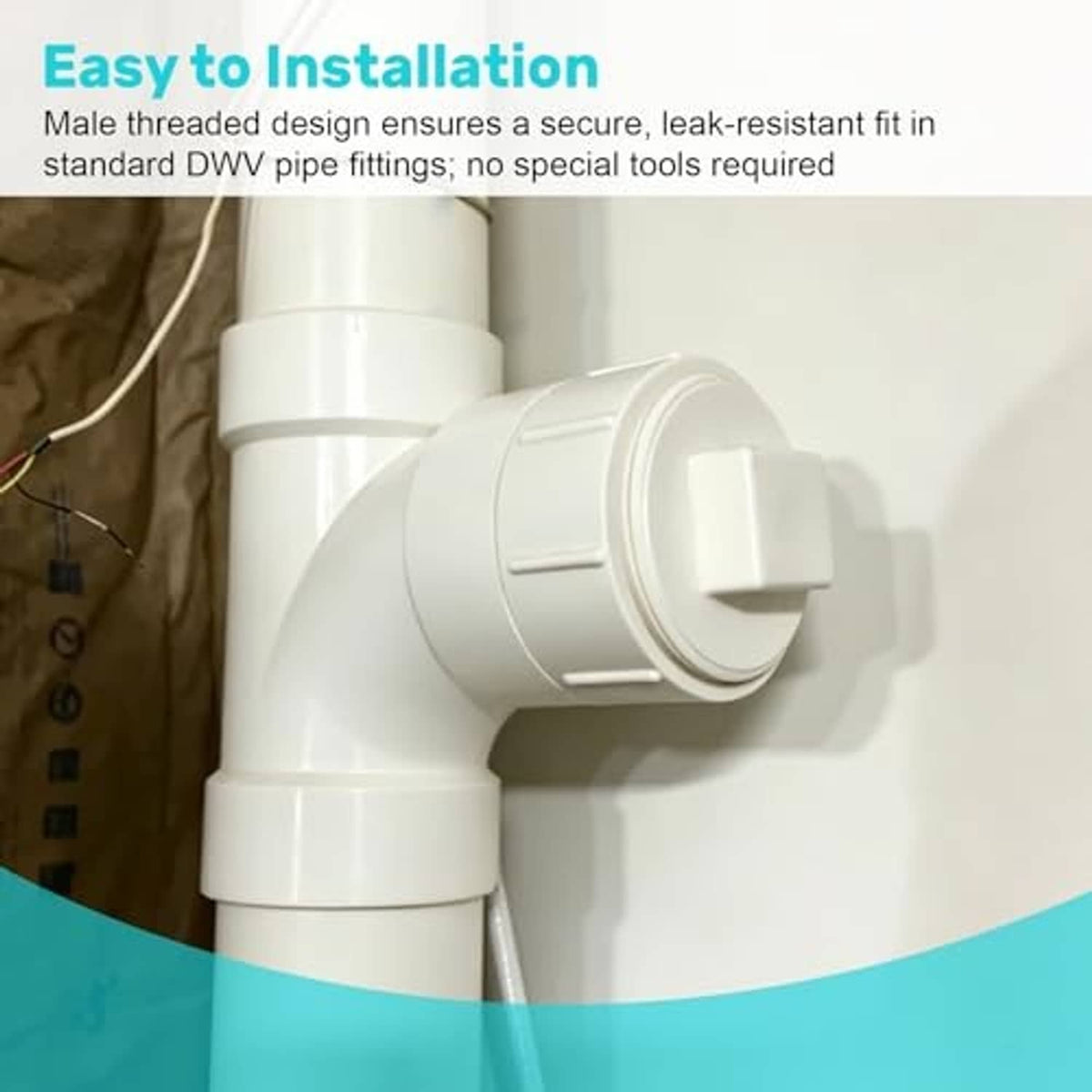 White PVC cleanout cap installed on a pipe elbow, showing threaded connection