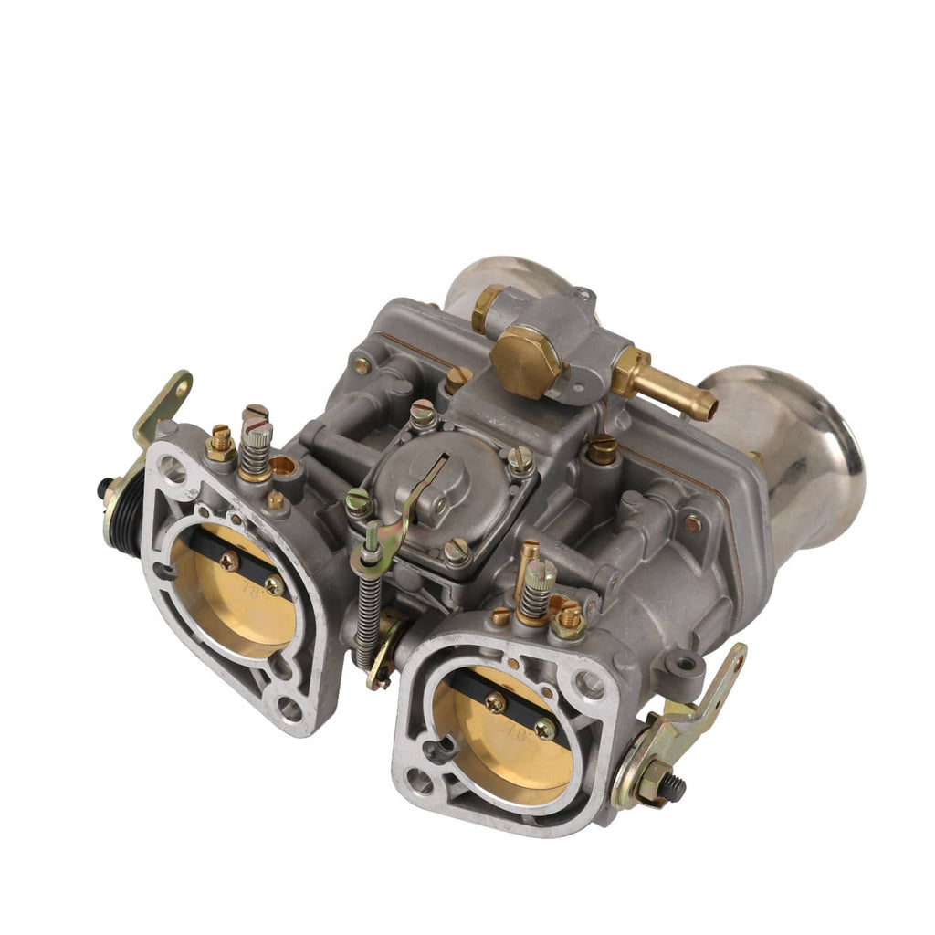 Dual carburetor with two circular ports, springs, and brass fittings on gray casing