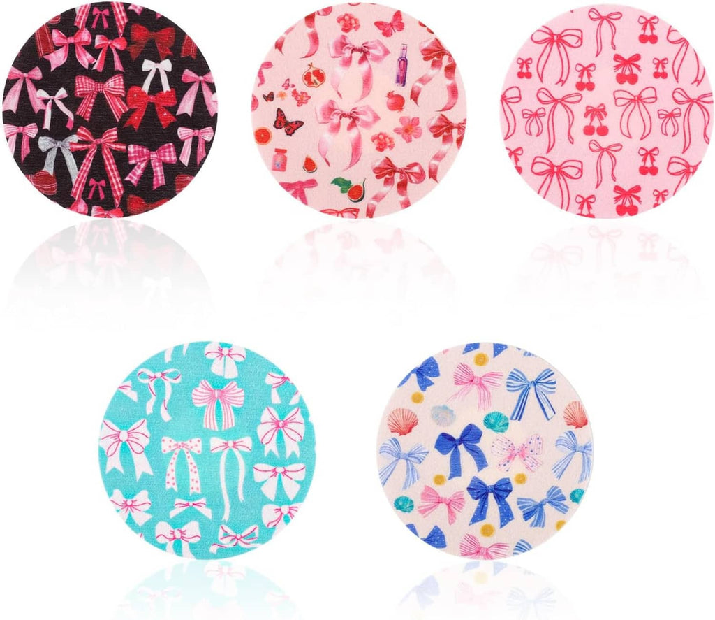 Five round waterproof sensor covers, patterned with bows and flowers in black, pink, teal, blue