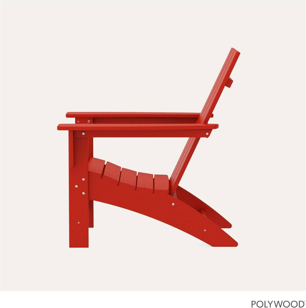 Red Adirondack rocking chair side view with slatted back and curved base