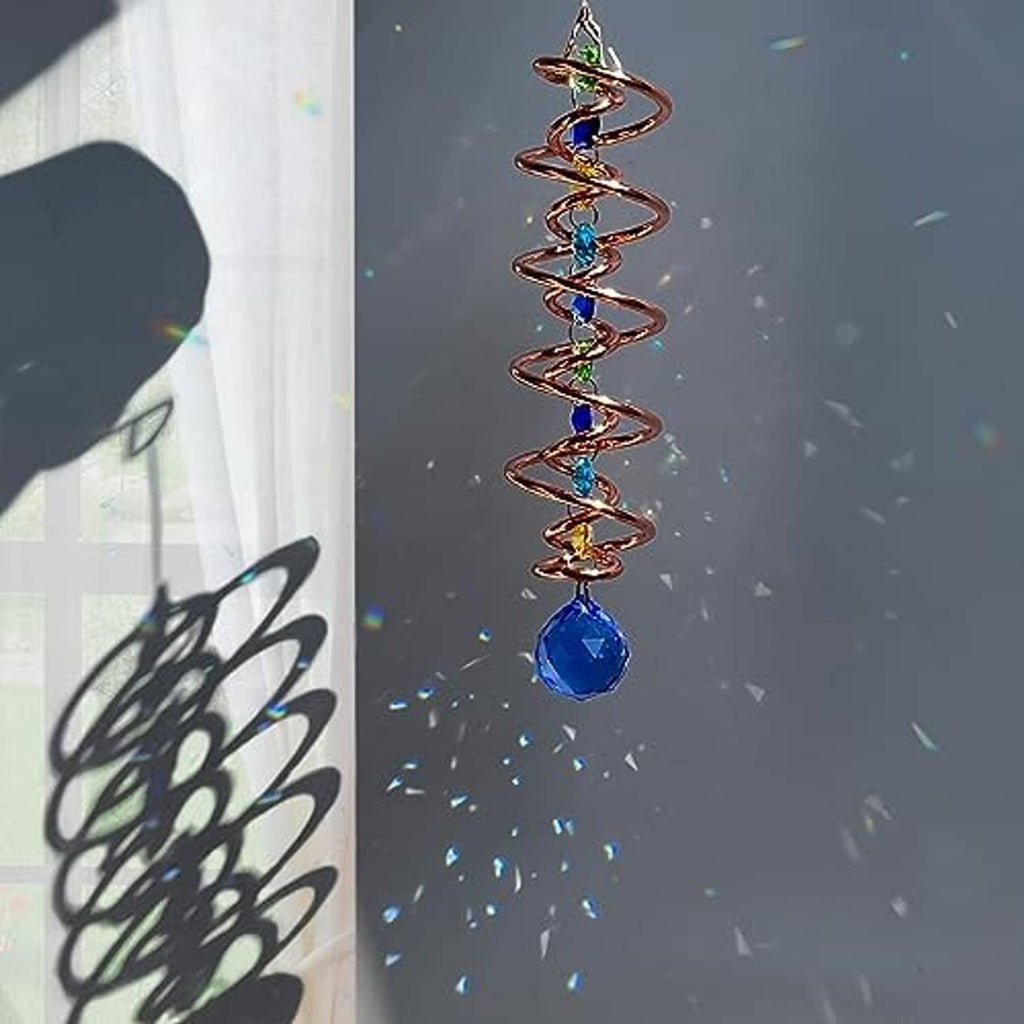 Close-up blue-copper spiral wind spinner with blue crystal drop and rainbow glass beads