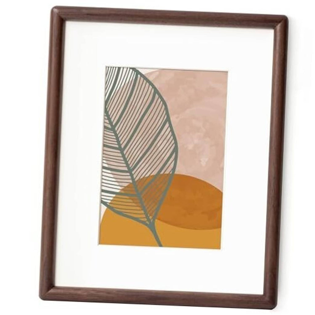 Walnut rounded-corner picture frame with white mat and abstract art print
