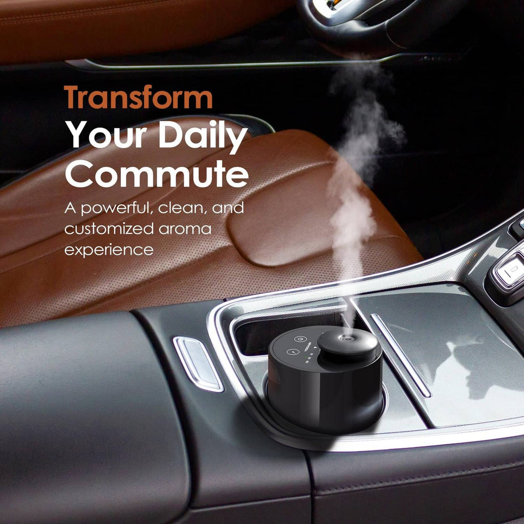 Compact black waterless diffuser placed in a car cupholder area
