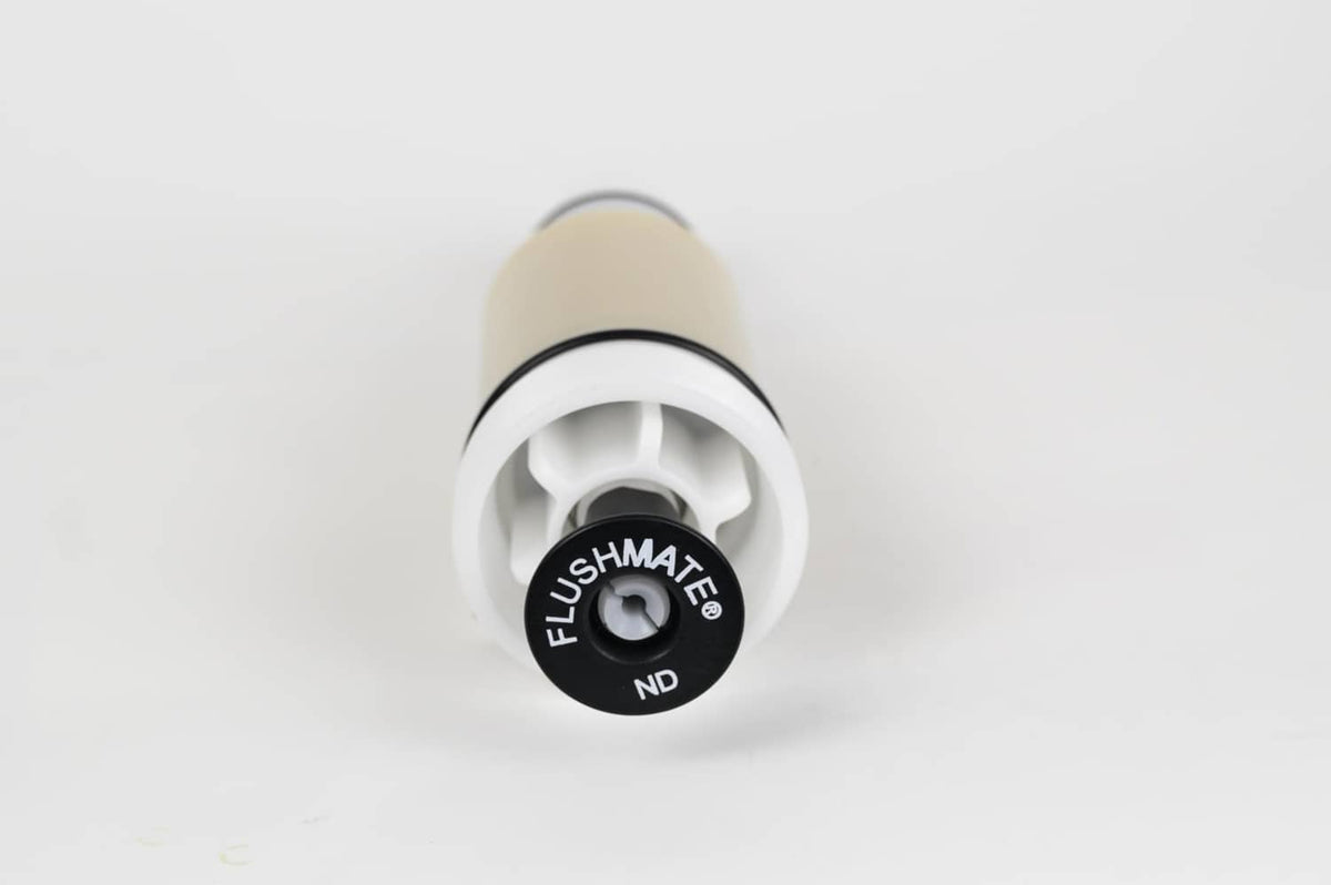 Flushmate flush valve cartridge close-up with black FLUSHMATE ND cap