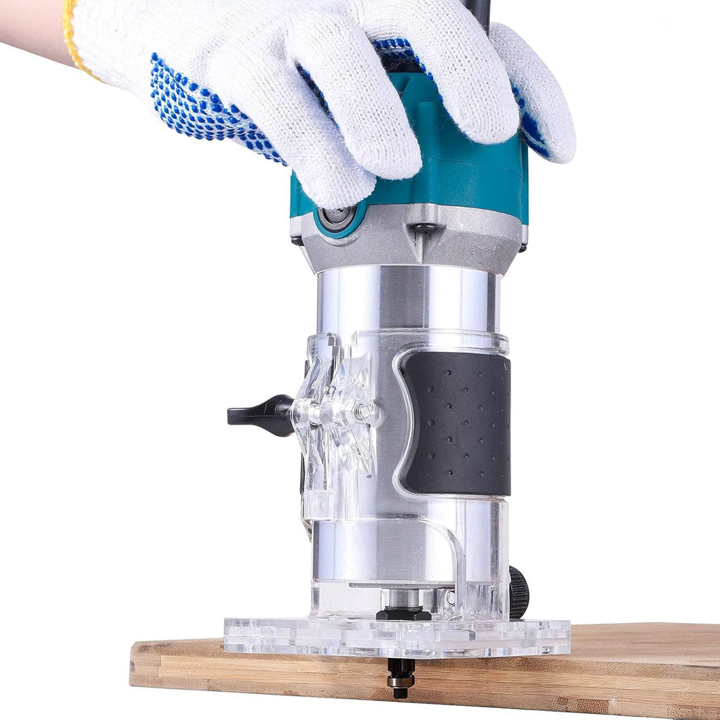 Electric router held against wood with gloves, teal motor and transparent base