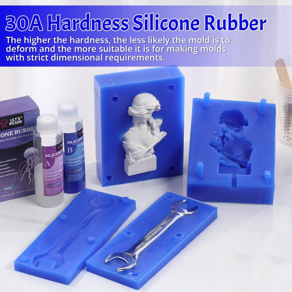 Blue silicone mold blocks with sculpture cavities and silicone rubber bottles
