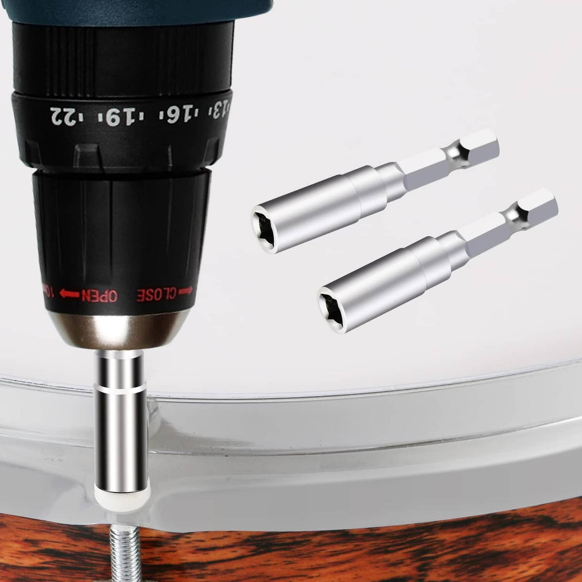 Drum tuning drill bits with tuning key, shown in close-up silver metal