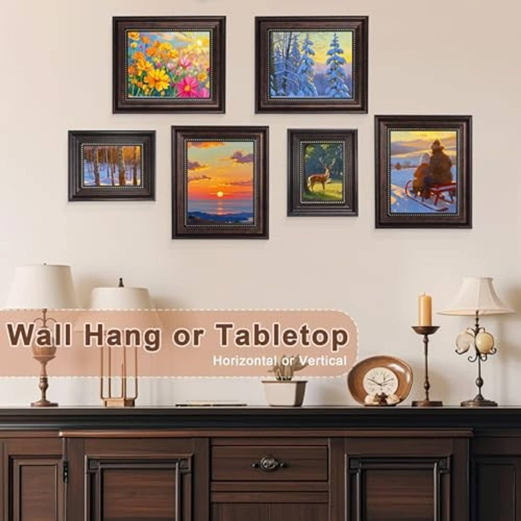 Set of small vintage black picture frames with gold bead trim, wall display of landscape photos.