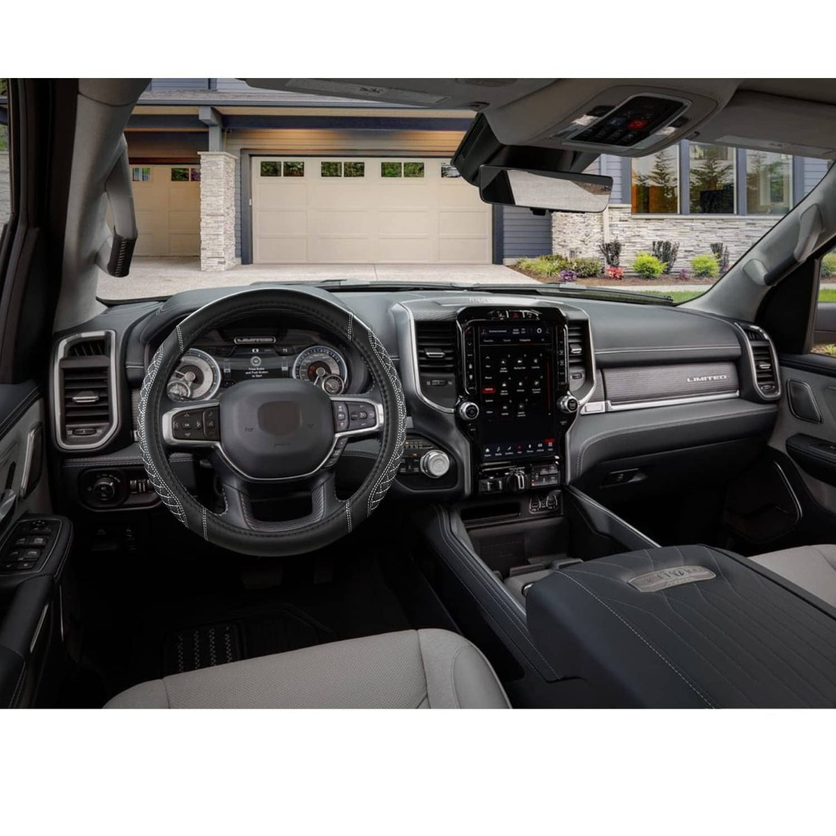 Steering wheel cover on a car interior, black design with white stitched perimeter and grip