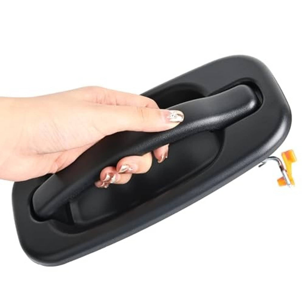 Black exterior door handle with textured lever and recessed grip, held in hand