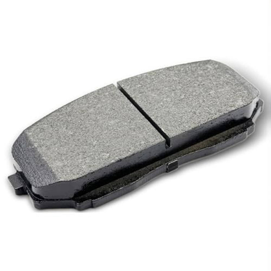 Front ceramic brake pad with gray friction surface and black backing plate, angled view