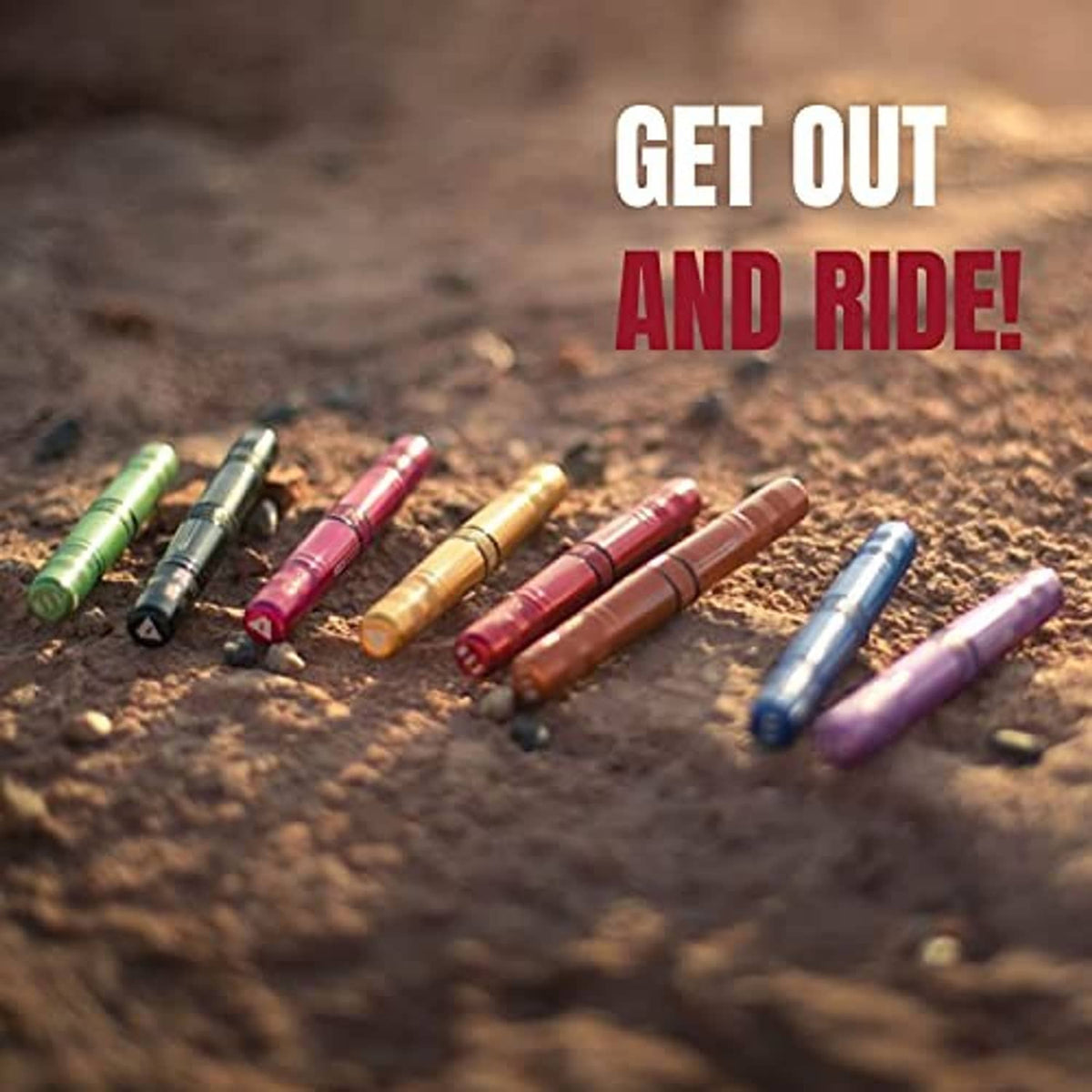 Assorted colored tubeless tire repair tools laid out on a surface