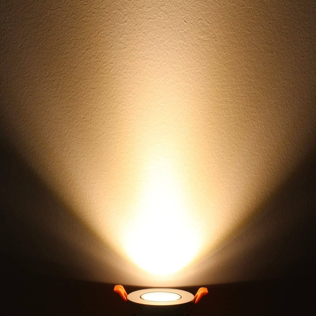 On recessed LED downlight emitting warm white light with visible beam