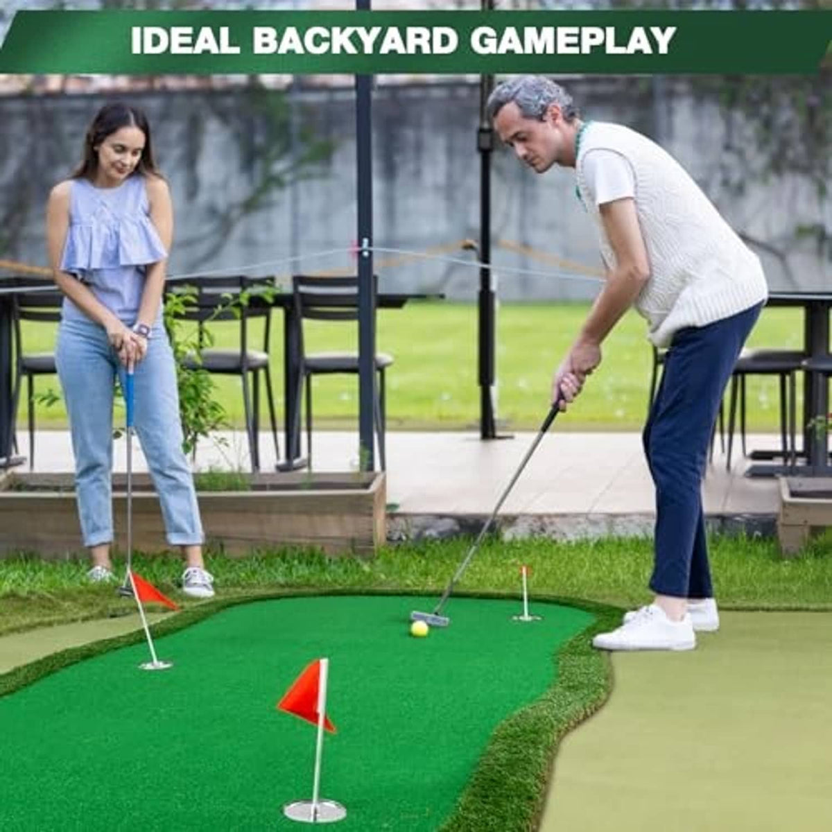 Green artificial golf putting green mat with several cup flags and players practicing