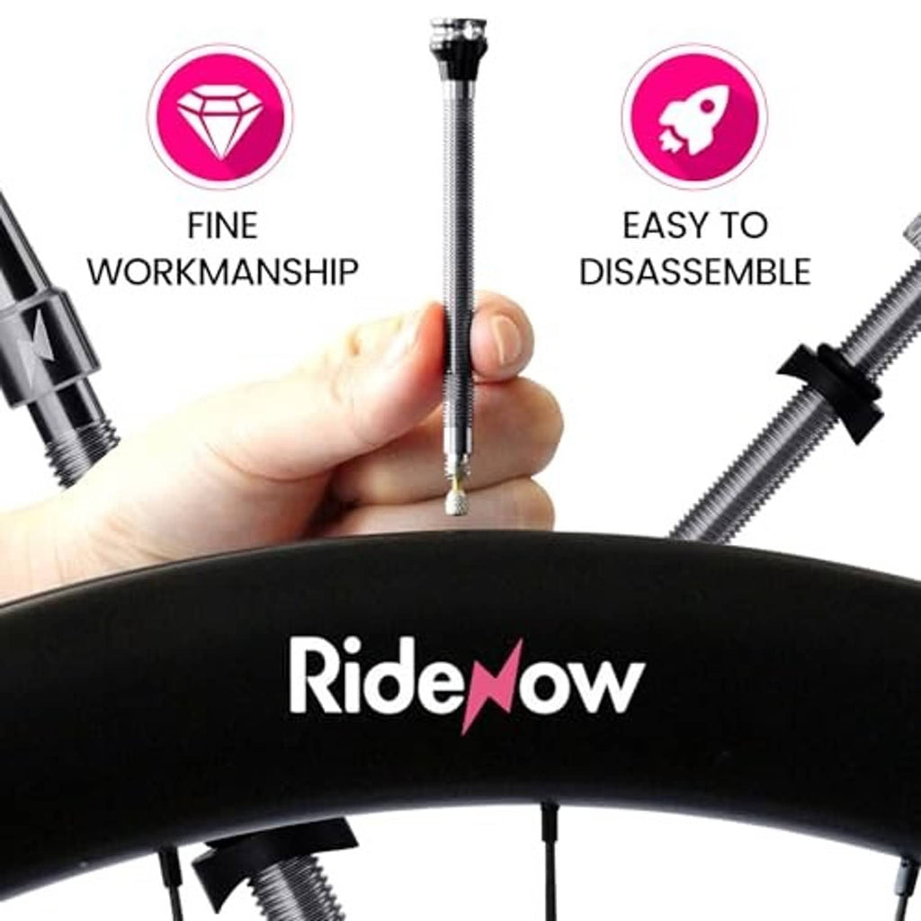 Presta tubeless valve stem held in hand with metal threads and rubber mounting base