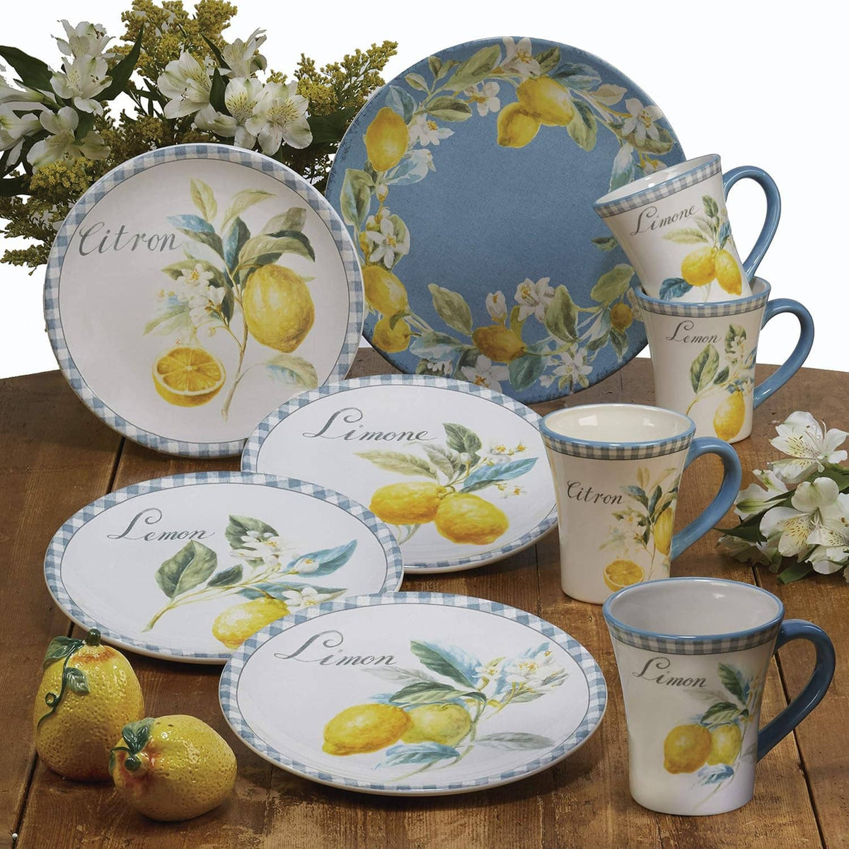 Set of lemon-pattern dinnerware with matching blue-and-yellow Citron plates and mugs