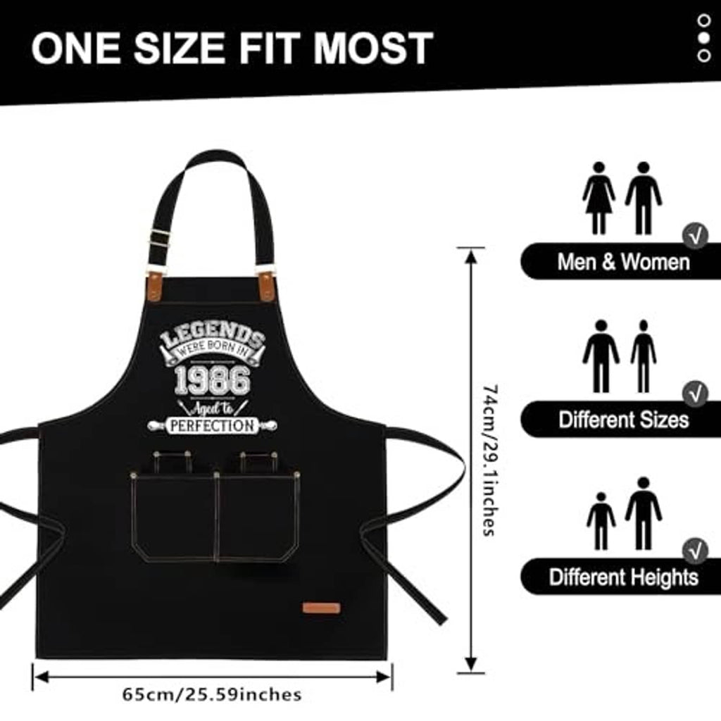 Black adjustable apron with leather-look straps and two front pockets, laid flat.