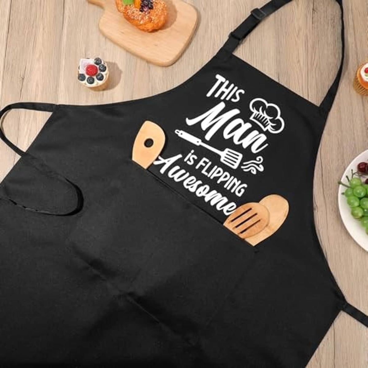 Black cooking apron with 'This Man' print and novelty chef mitt graphic