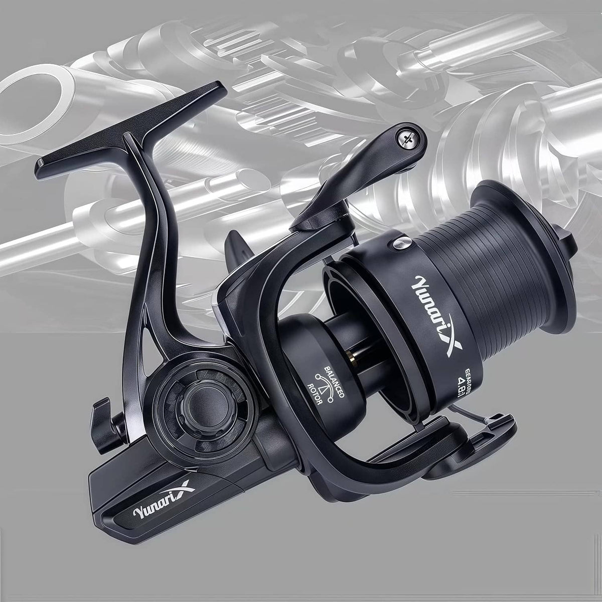 Black spinning fishing reel close-up showing handle, bail, and ribbed spool