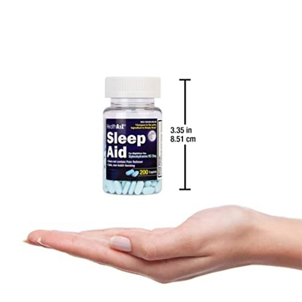 Sleep aid caplets bottle held above open palm with size markings