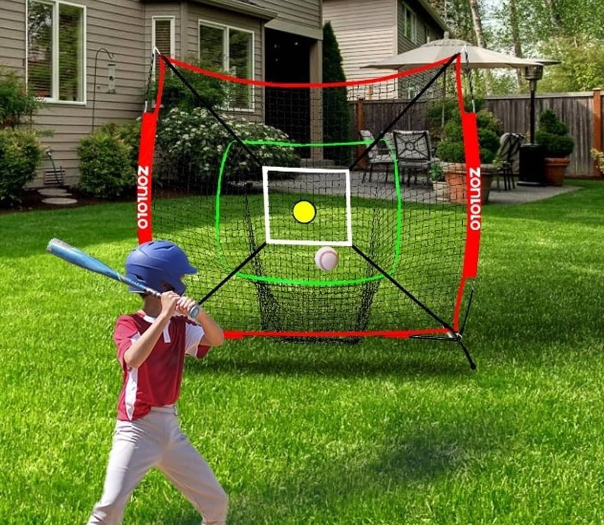 Outdoor backyard hitting net with white mesh, red frame, green rings, and a center target ball.