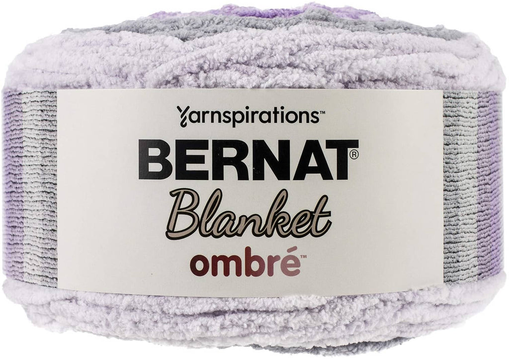 Bernat Ombre blanket yarn skein in purple, lavender, and light gray, super bulky