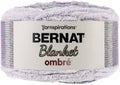 Bernat Ombre blanket yarn skein in purple, lavender, and light gray, super bulky