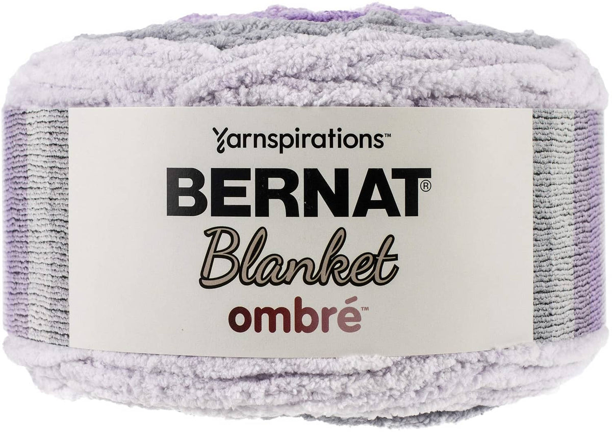 Bernat Ombre blanket yarn skein in purple, lavender, and light gray, super bulky