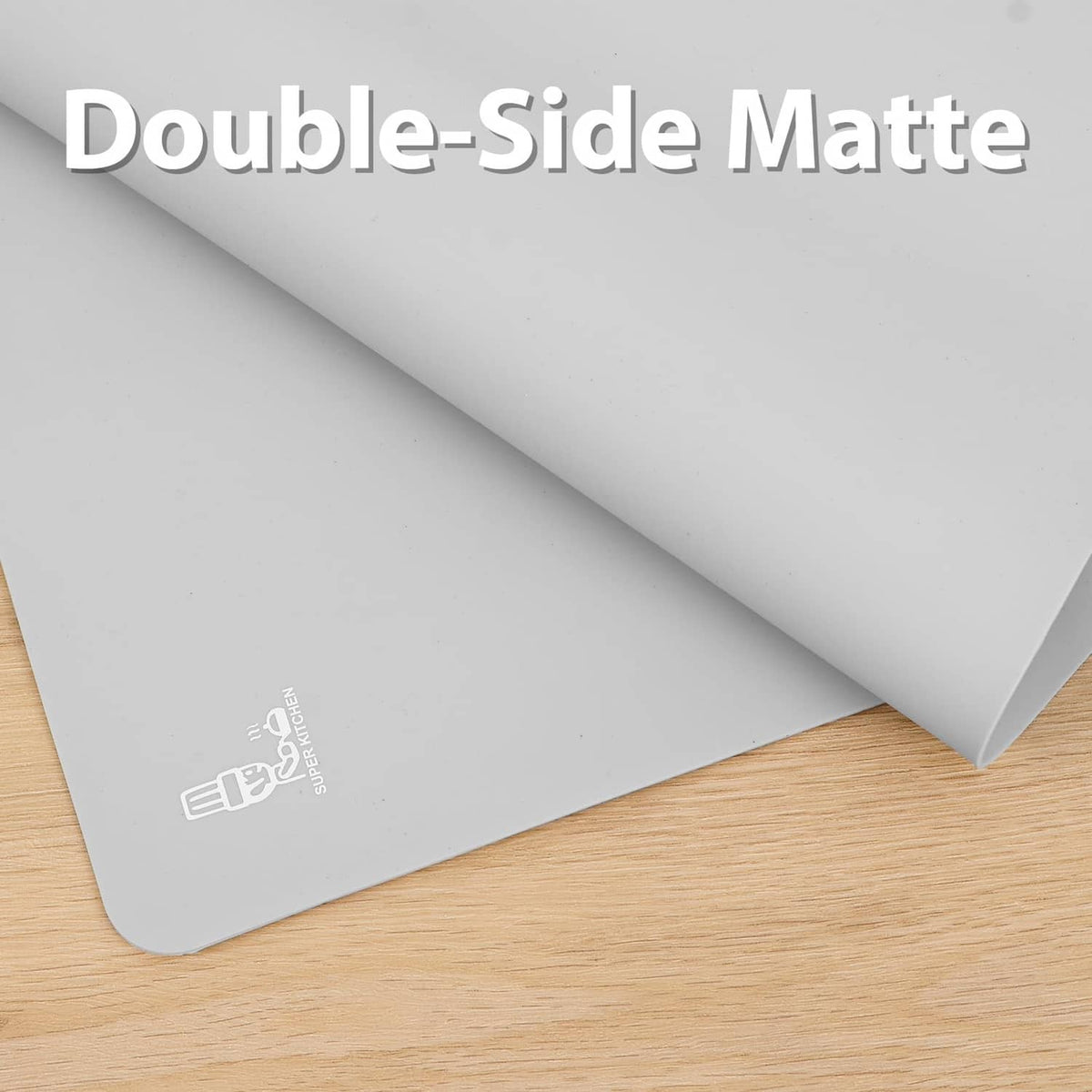 Gray silicone mat with folded corner showing double-sided matte surface