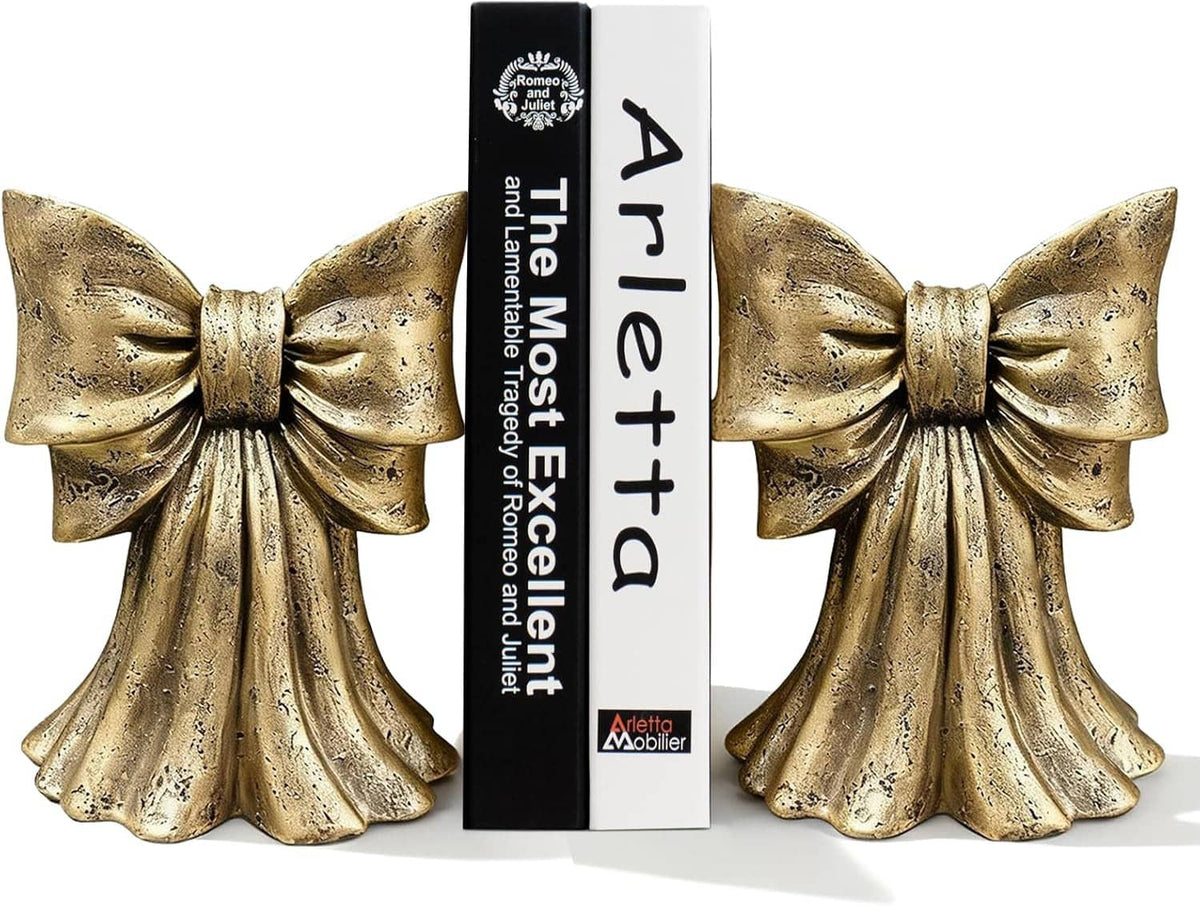 Gold bow bookends set of 2 with ribbon bows and speckled metallic texture