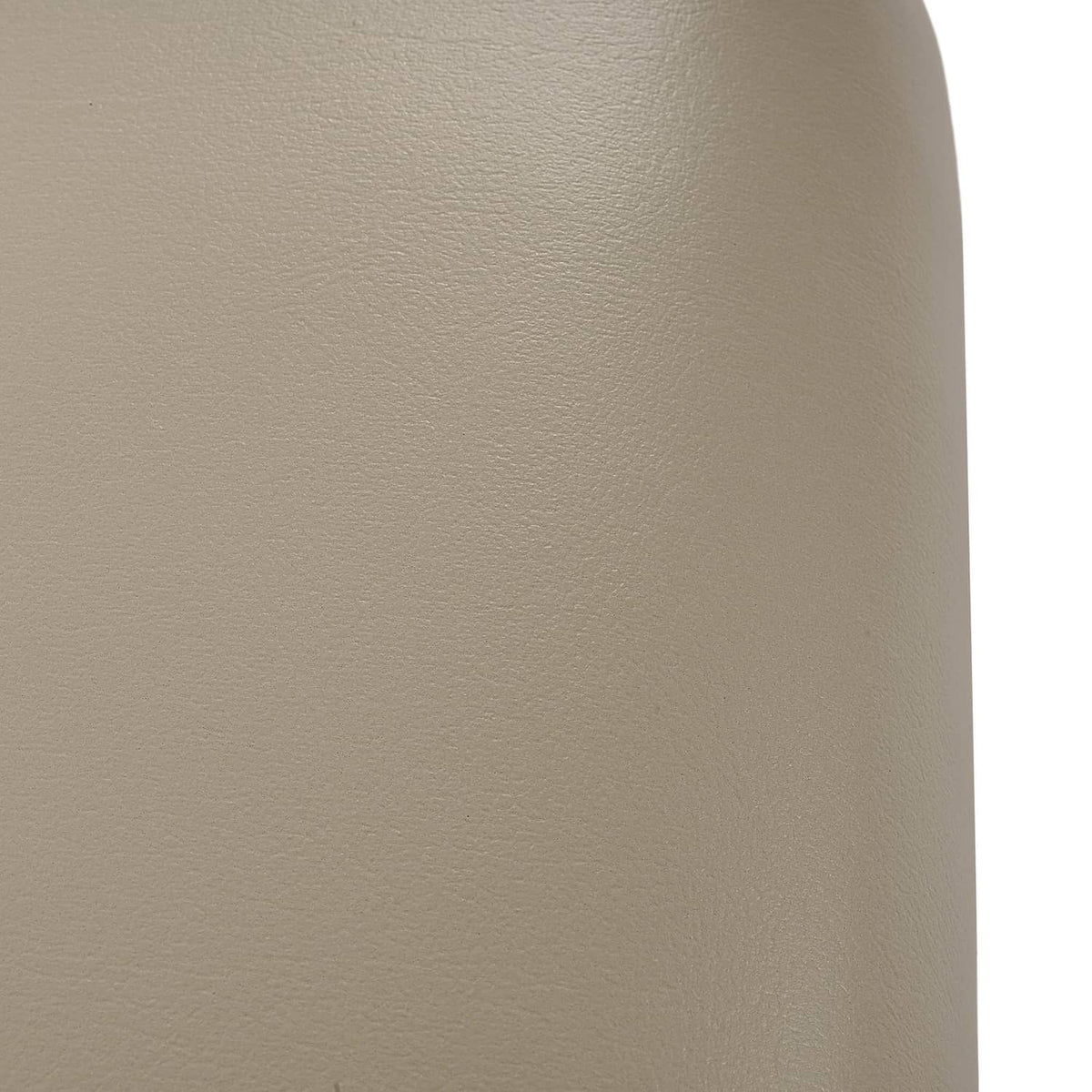 Beige cushion cover close-up showing fine grain texture