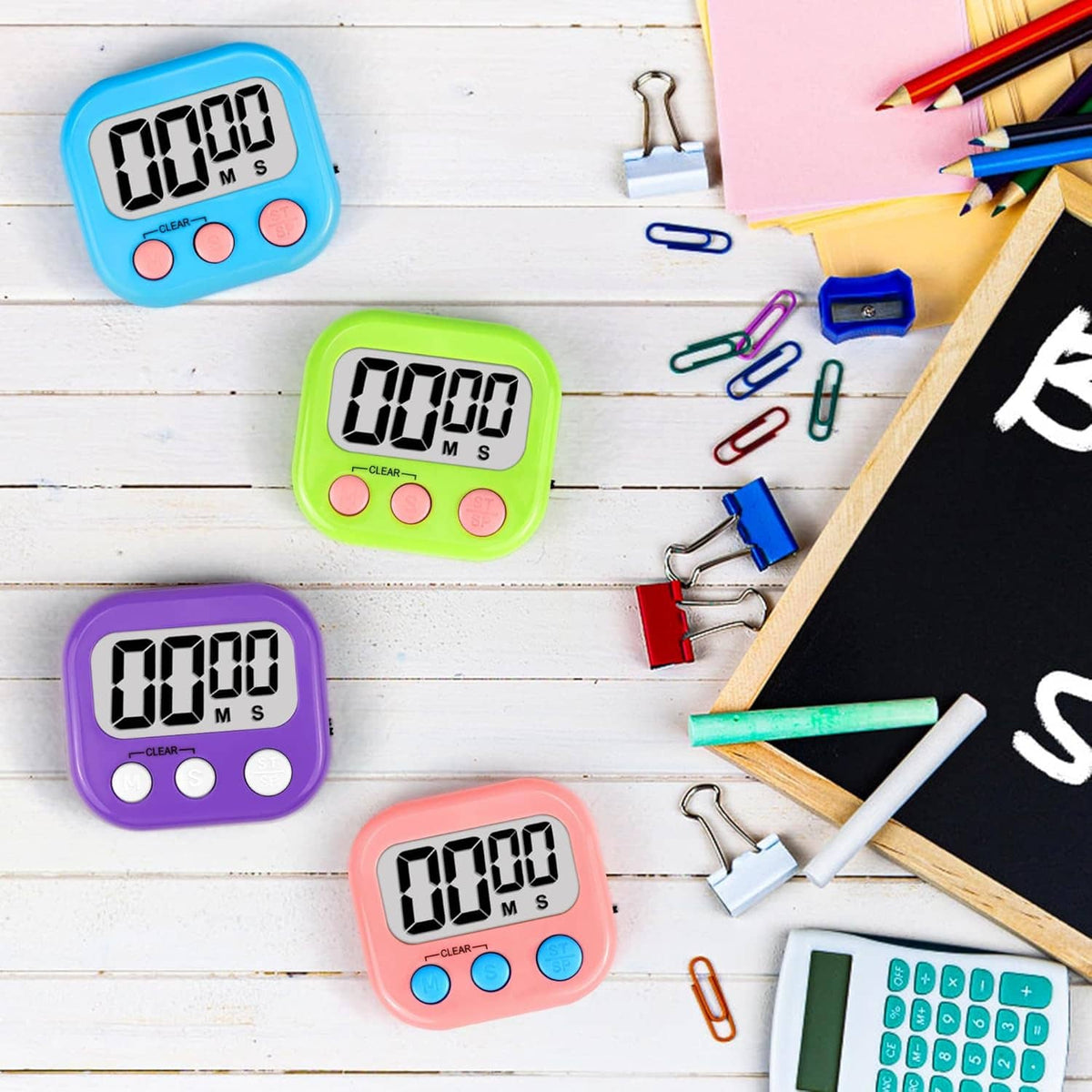Set of four kids digital timers in blue, green, purple, and pink with LCD digits