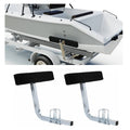 Pair of trailer guide-on bunk boards with black carpet pads and galvanized steel frames