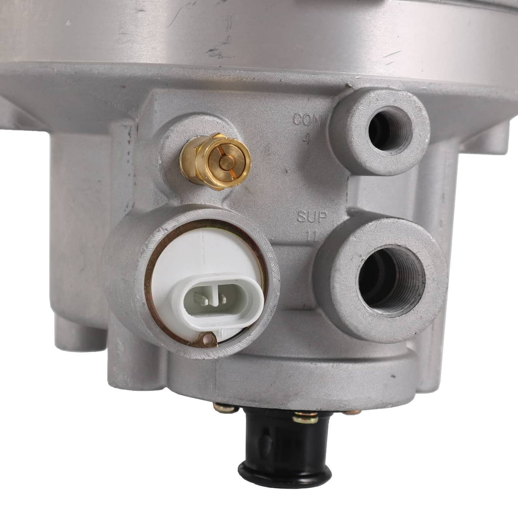 Air dryer ports and electrical connector on silver housing, threaded fittings visible