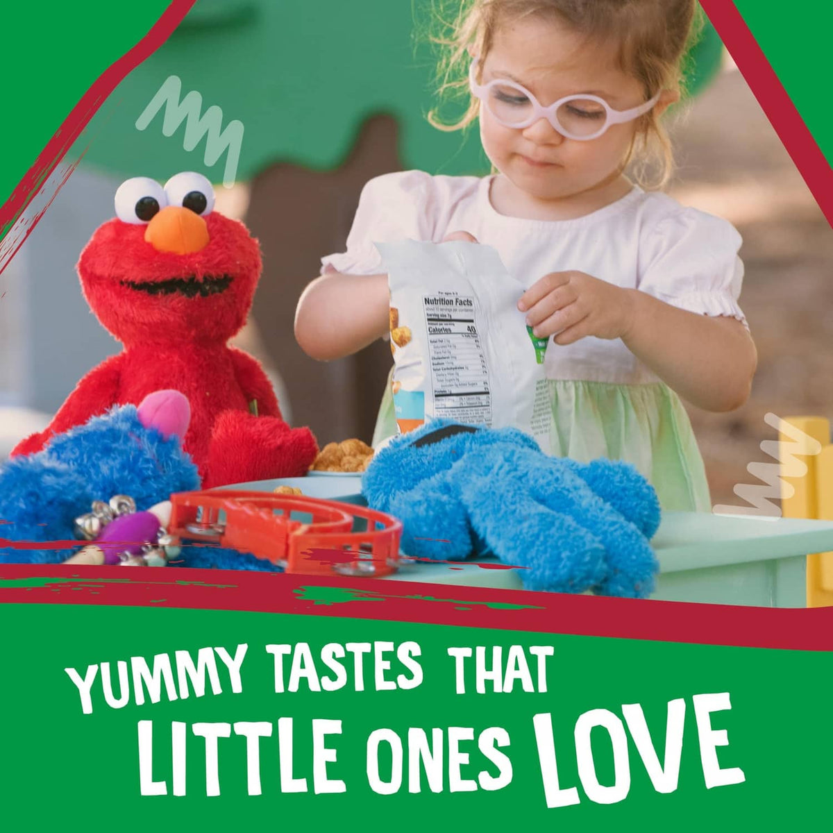 Child examining a snack package with Sesame Street character on table