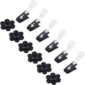 Black flower-shaped rubber stoppers and black garden flag clips with clear caps