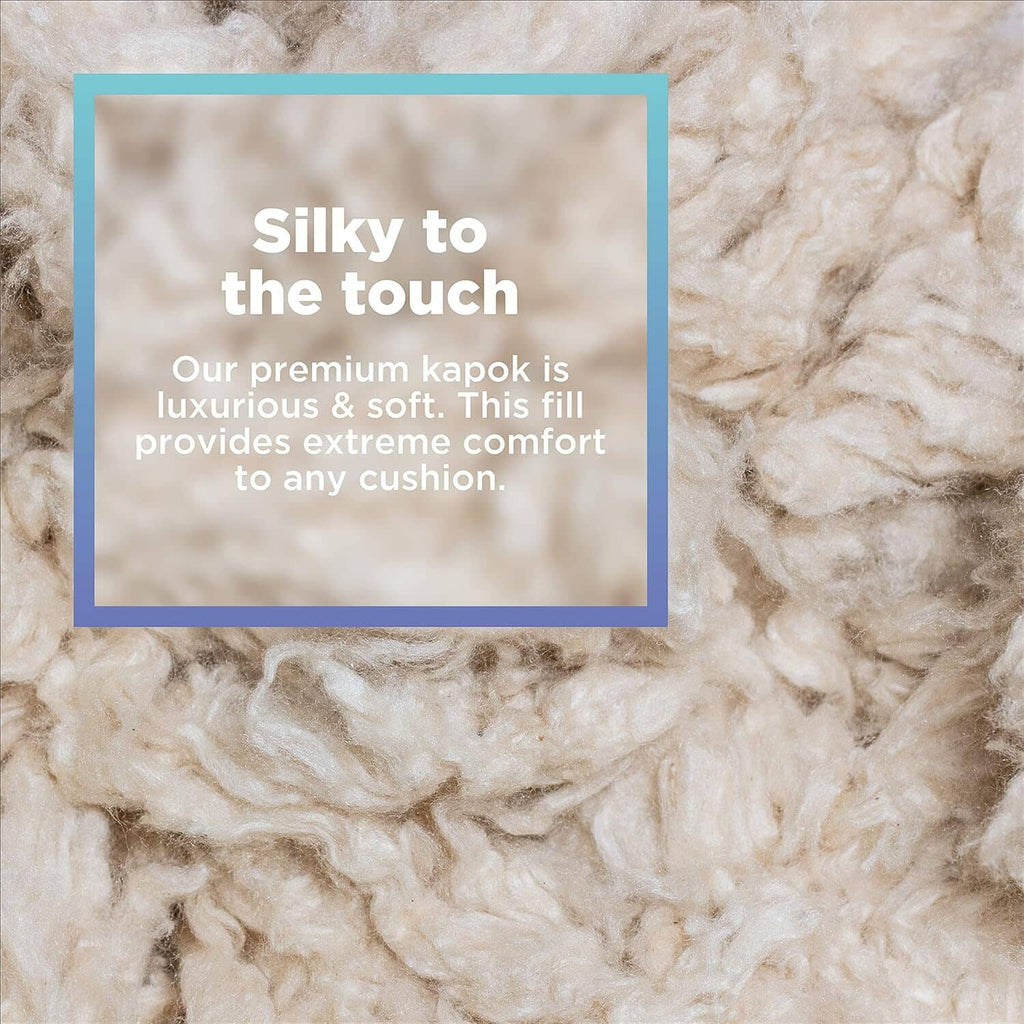 Premium kapok fiber fill, creamy white soft fluffy texture close-up.