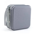 Gray hard plastic DVD case with carrying strap and zipper closure for discs