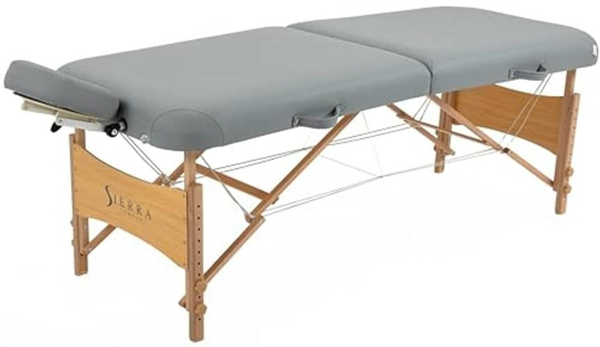 Gray padded massage table with headrest and wooden folding frame, side view