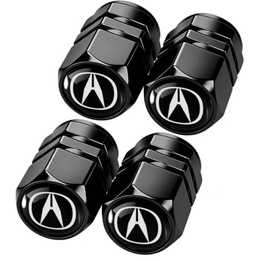 Four black metal valve stem caps with Acura logo, glossy faceted hex sides