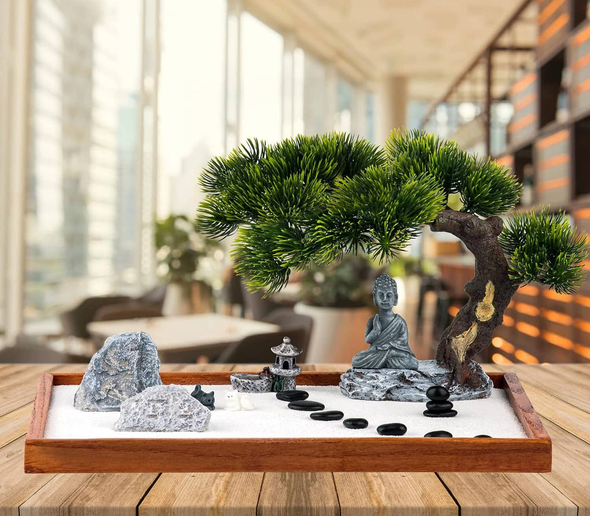Mini zen garden kit with Buddha statue, pine tree ornament, rocks, and black balancing stones
