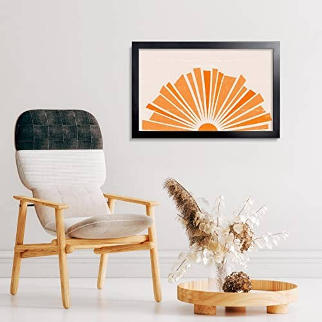 Black picture frame with orange sunburst print and clear front cover