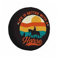 Black round spare tire cover with colorful sunrise horse silhouette graphic