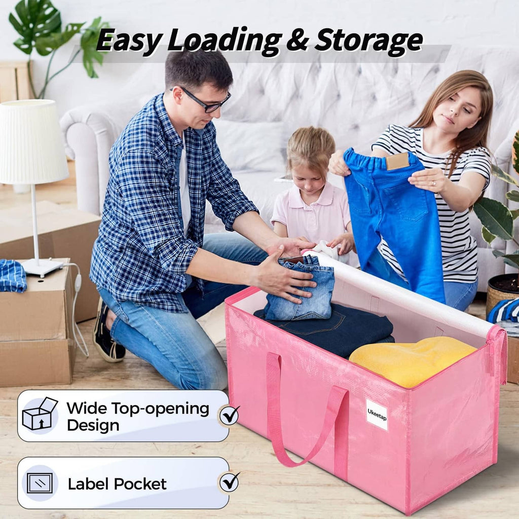 Pink storage bin with wide top opening and front label pocket, in use