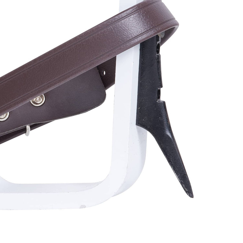 Adjustable tree-climbing spur close-up with dark brown strap, black spike, white base