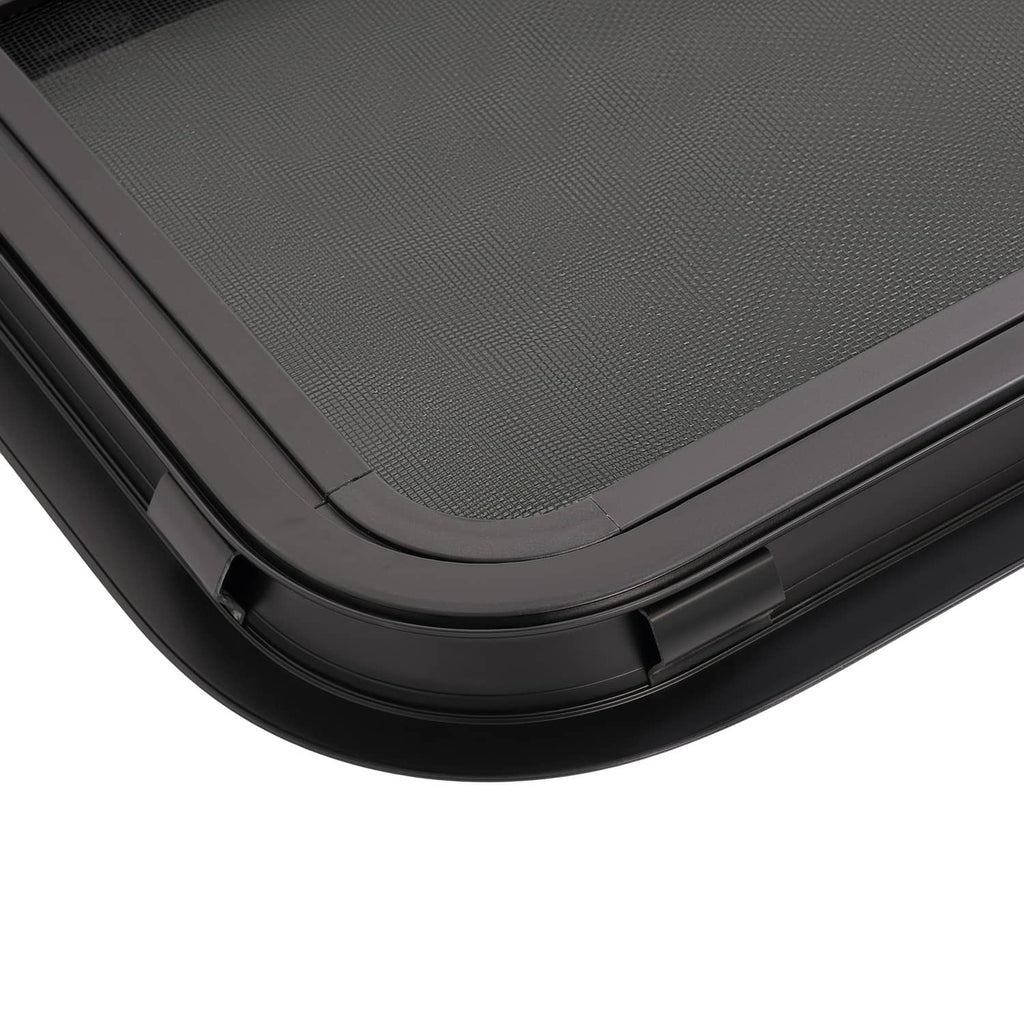 Black RV window frame with dark screen, curved bottom track