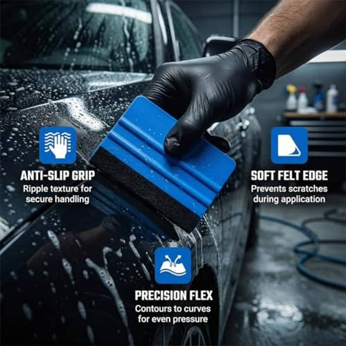 Handheld blue felt-edge vinyl squeegee tool with black foam scraping pad